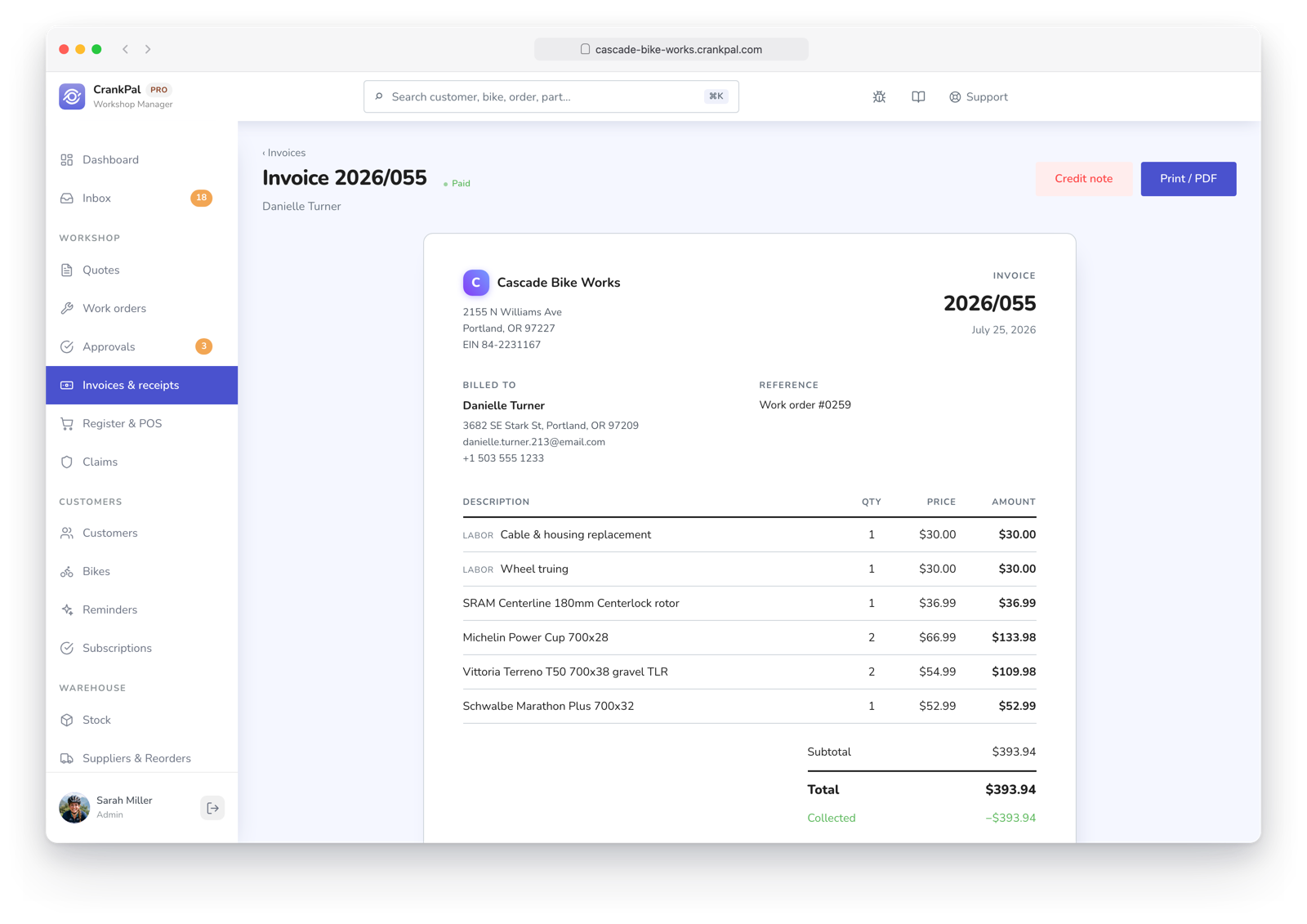 Fattura elettronica nel gestionale CrankPal con righe di manodopera e ricambi, totale, IVA, stato pagata, download XML della fattura elettronica, stampa PDF e nota di credito.