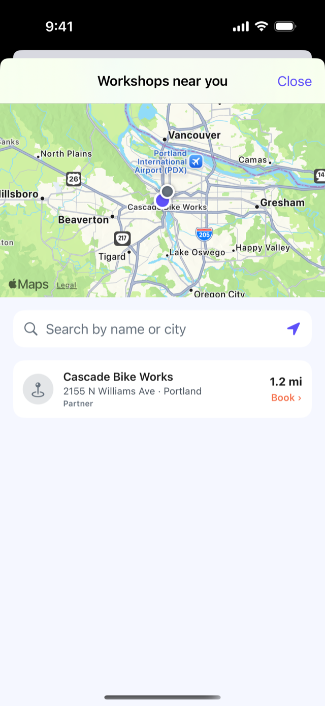 The CrankPal app: the map of workshops nearby, with the workshop card, the distance and the button to book